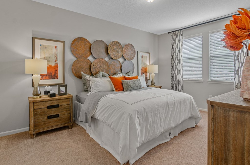 a bedroom with a bed and nightstand