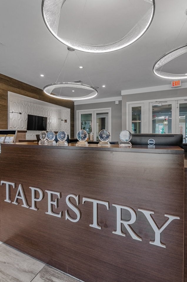 Tapestry Bocage office with several awards on the desk