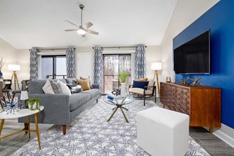 a living room with a couch and a tv