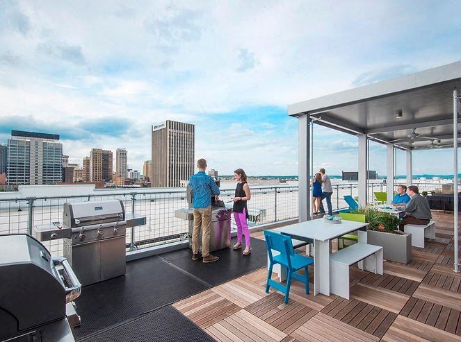 a group of people are standing on a boat