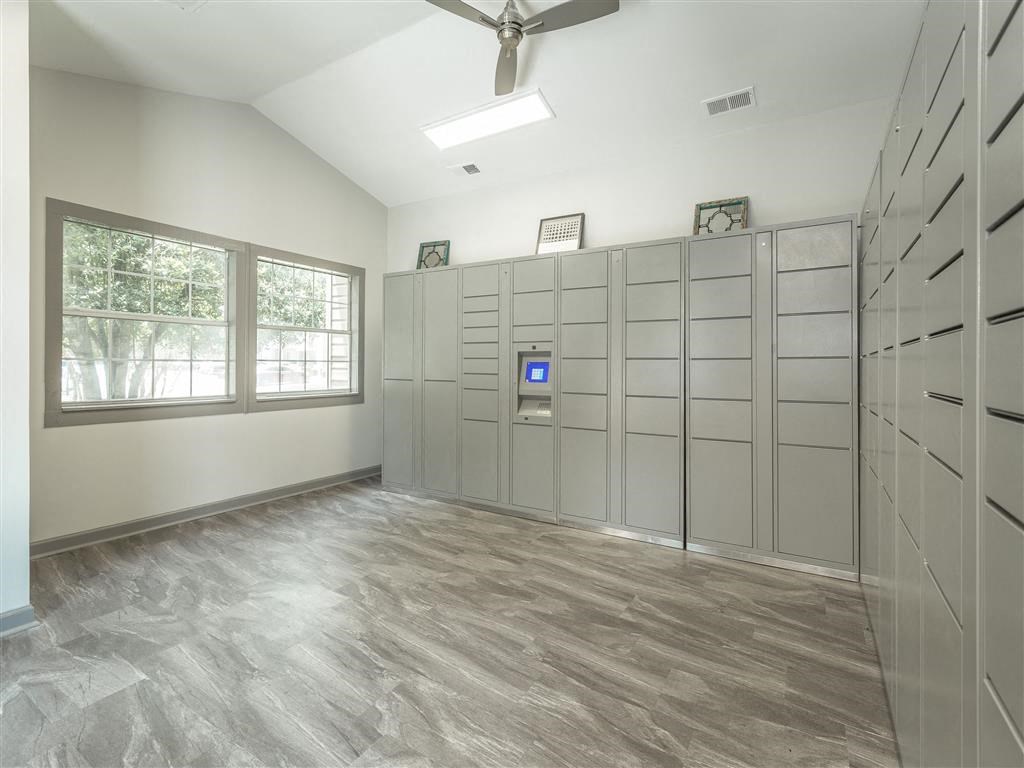 a large room with many lockers and a window