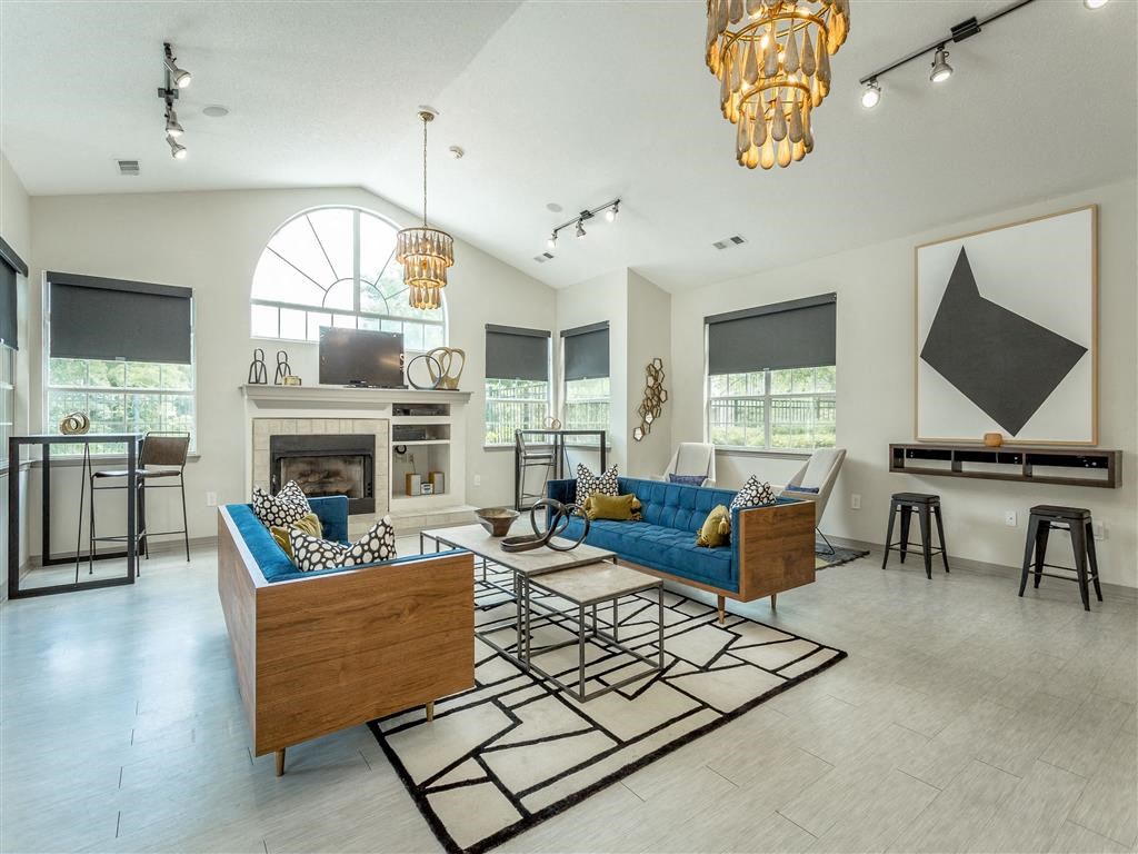a living room with couches and a fireplace