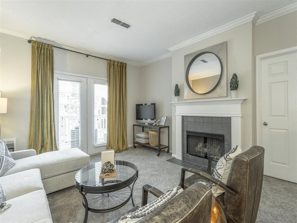 a living room with a couch and a fireplace