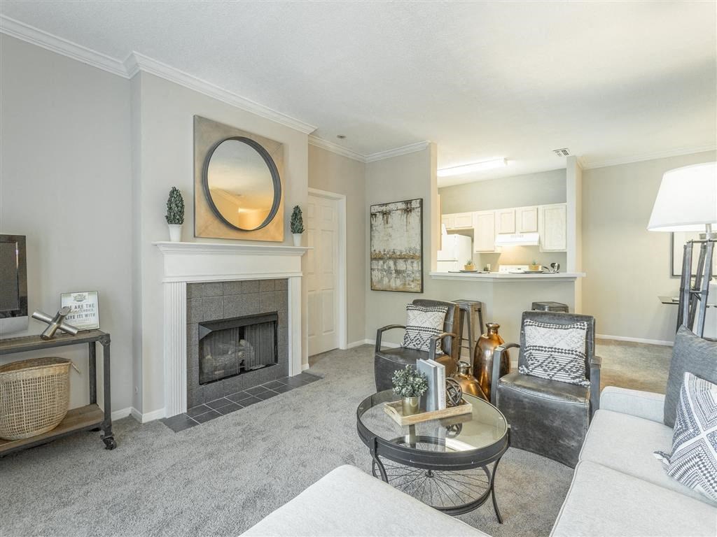 a living room with a fireplace and a couch