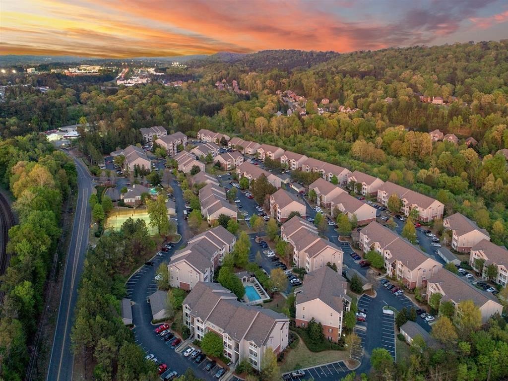 an aerial view of a neighborhood with houses and trees