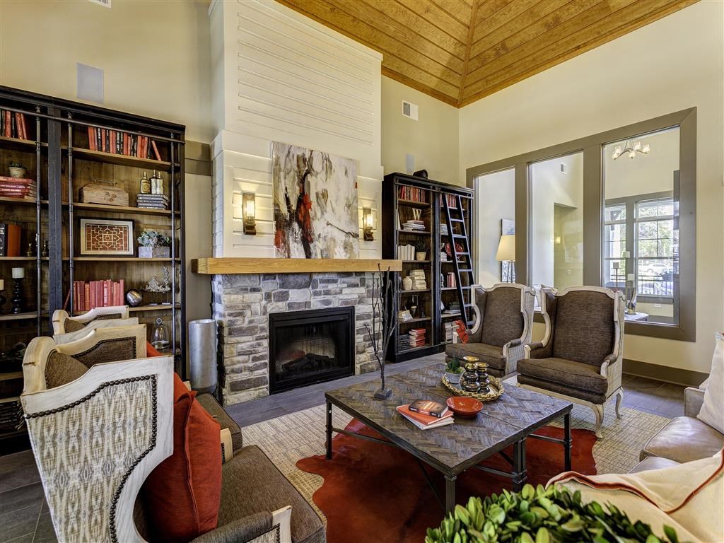 a living room filled with furniture and a fireplace