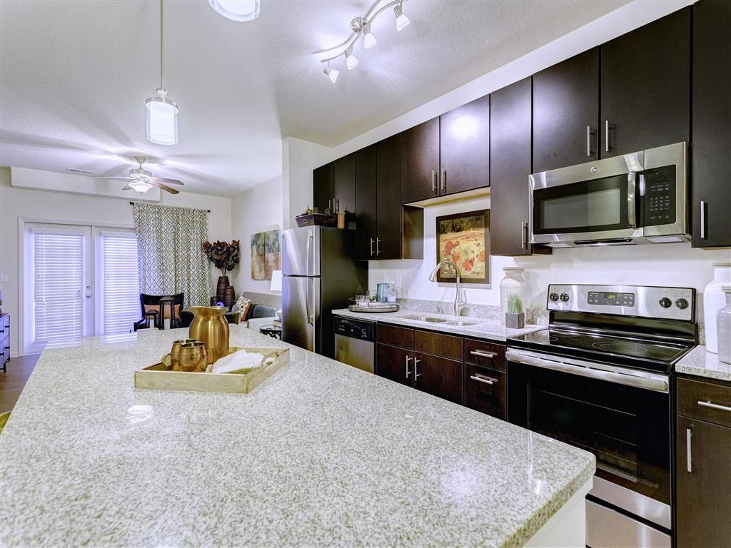 a kitchen with a granite counter top