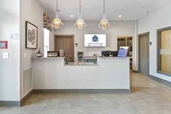 Clubroom with Complimentary Wi-Fi Clubhouse Entry Desk At Austin Place Apartments - Photo Gallery 3