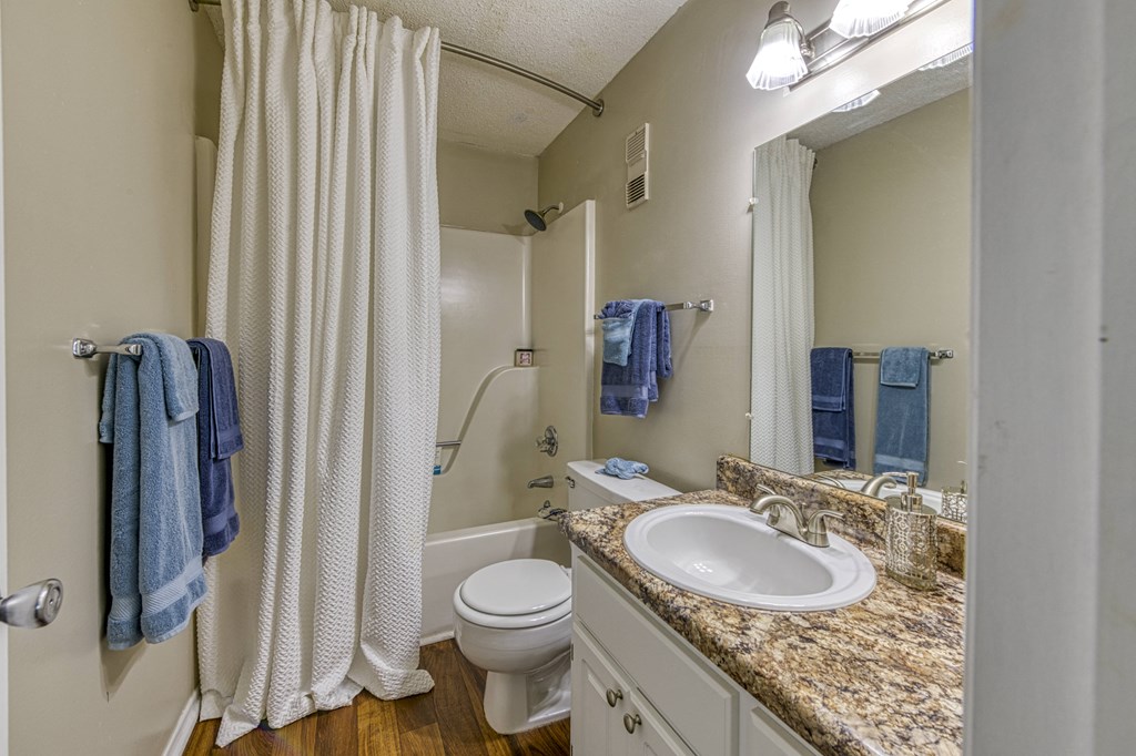 bathroom with wood-style floors at Ascent Jones Apartments in Huntsville, Alabama