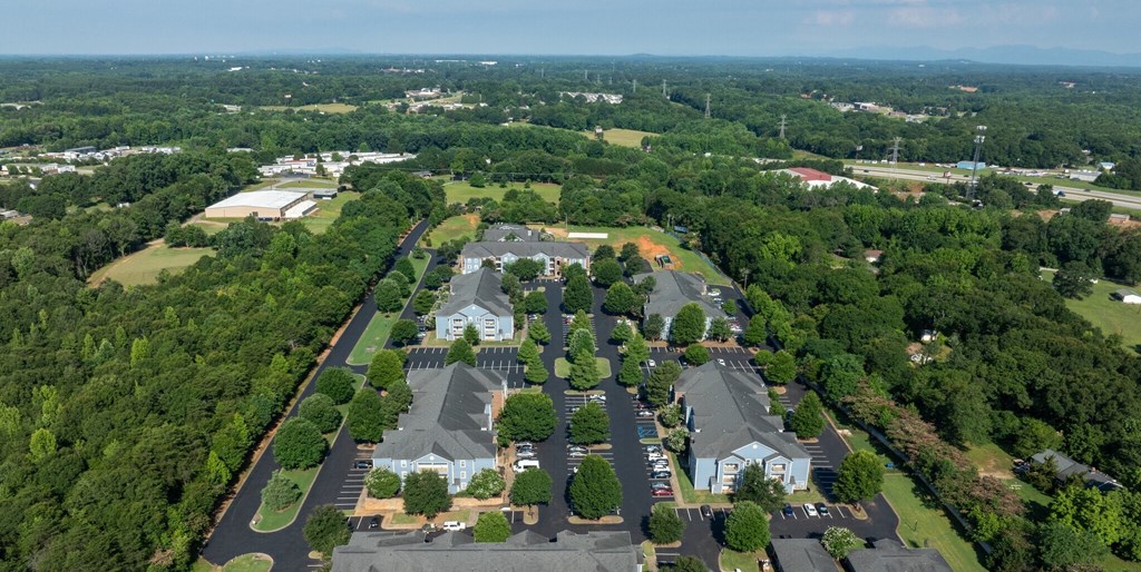 a birds eye view of a neighborhood with houses and trees