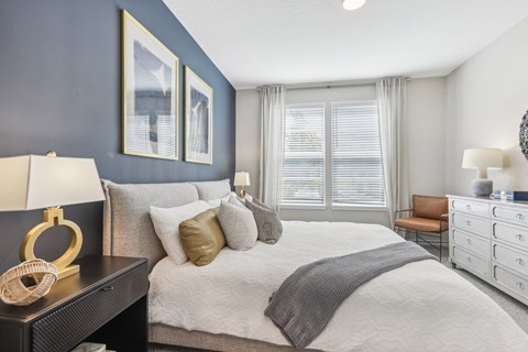 the preserve at ballantyne commons bedroom with large bed and windows
