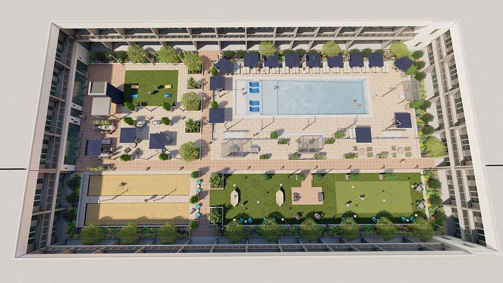 an aerial view of a building with a courtyard and a pool