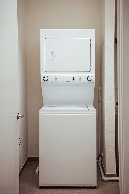 a white washer and dryer in a closet