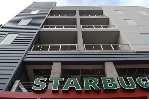 a building with a starbucks sign in front of it