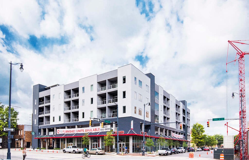 an image of an apartment building on a city street