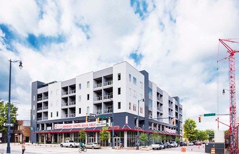 an image of an apartment building on a city street