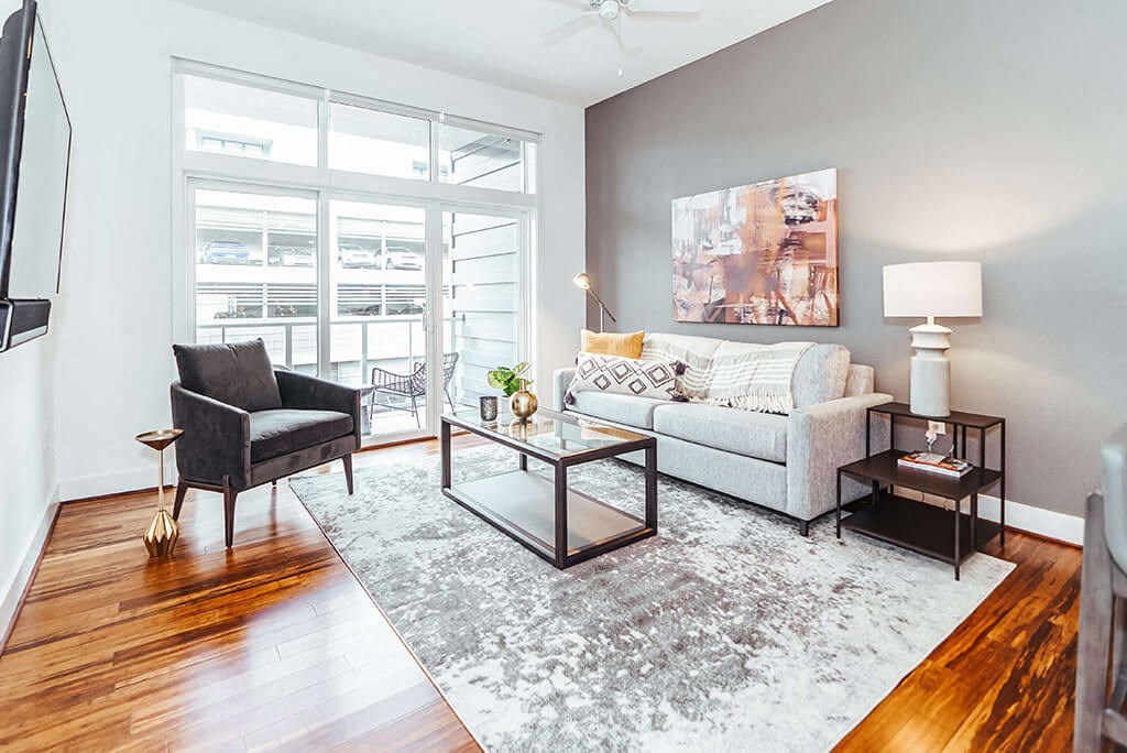 a living room with a couch and a window