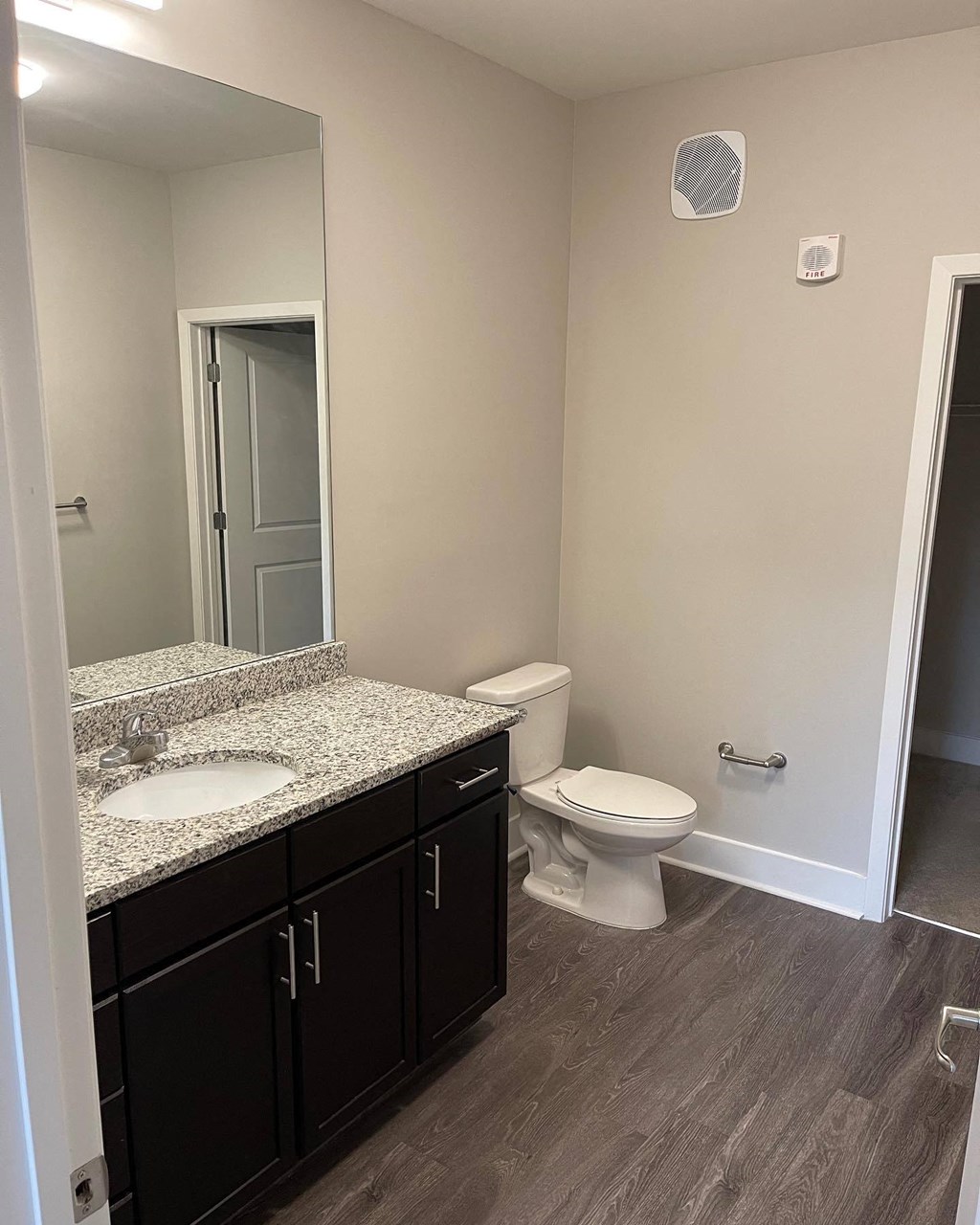 En-suite Bathrooms with wood floors at Flats on 4th Apartments in Birmingham, AL