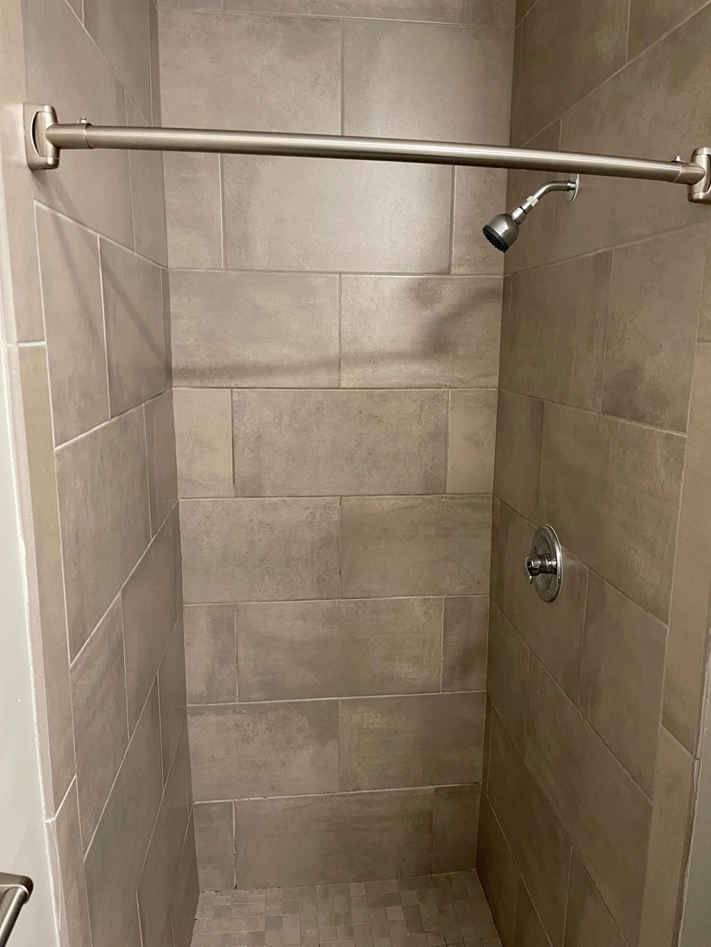 Tiled walk-in showers at Flats on 4th Apartments in Birmingham, AL