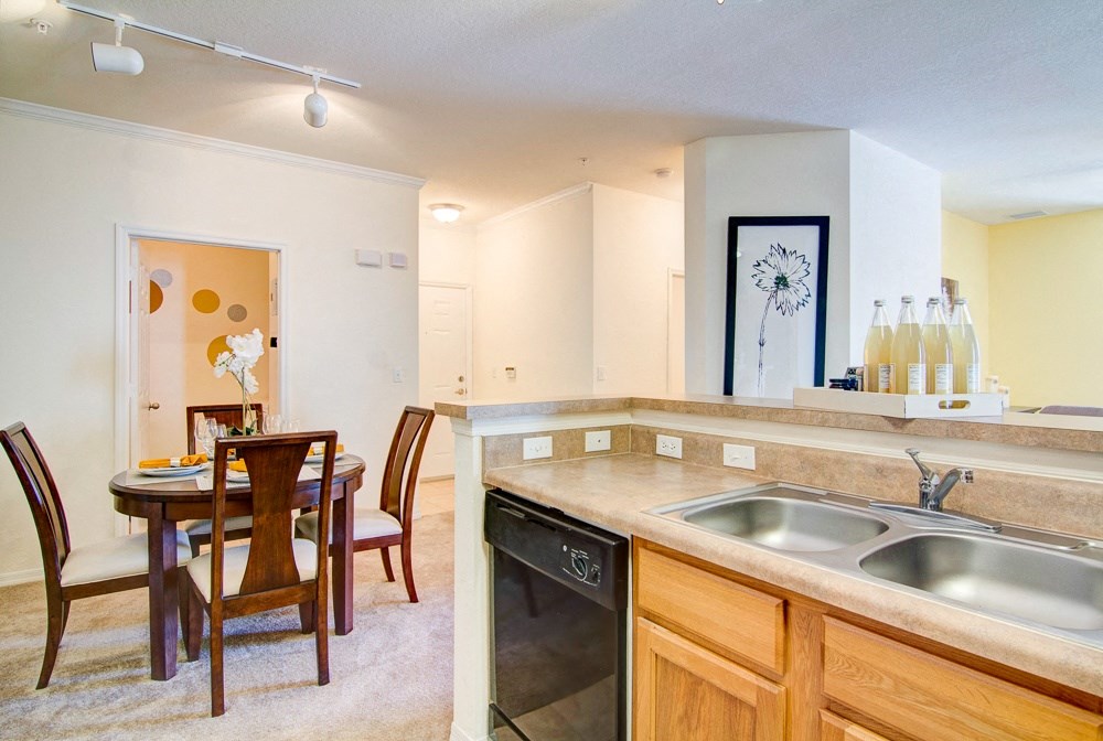 Kitchen with dishwasher at Legacy at Crystal Lake Apartments in Port Orange, Florida