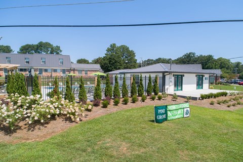 a house with a yard and a street sign in front of it