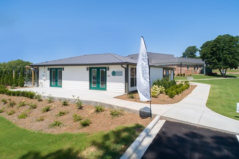 a white house with a flag in front of it