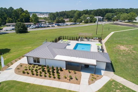 an aerial view of a house with a swimming pool