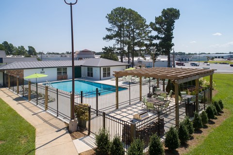 a view of a pool and a house with a pool