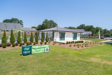 a house with a green sign in front of it