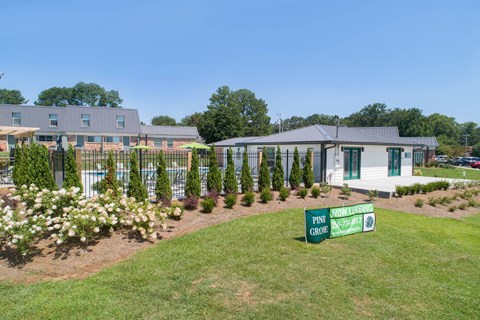 a house with a yard and a street sign in front of it
