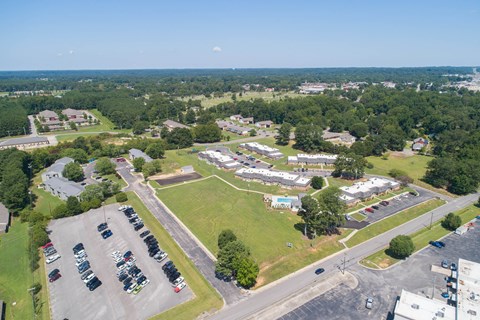 an aerial view of the parking lot of a city park
