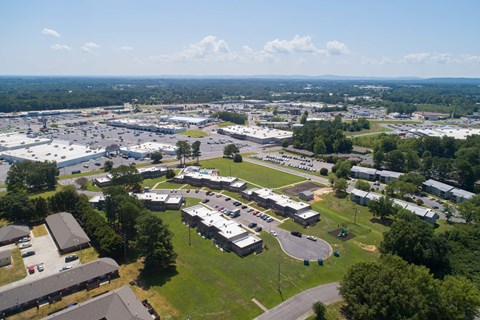 an aerial view of the parking lot of a school in the city