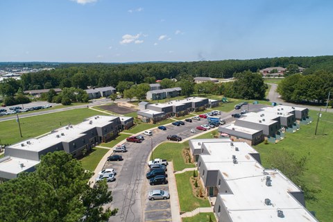 an aerial view of an industrial park with buildings and cars