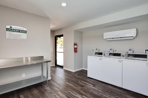 a kitchen with a counter and a stove and a sink