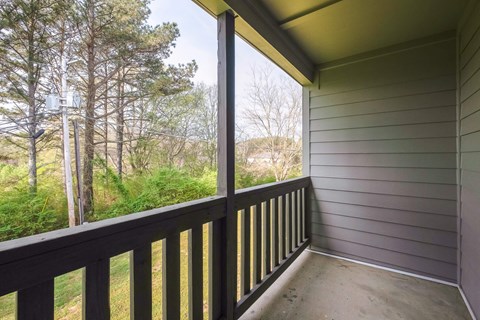 the view from the deck of a home with a large window