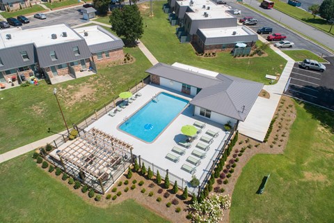 an aerial view of a house with a swimming pool