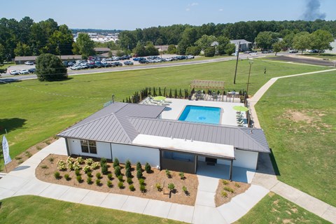 an aerial view of a house with a swimming pool