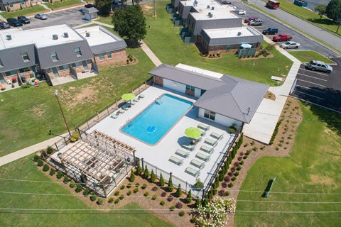 an aerial view of a house with a swimming pool