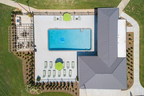 arial view of a pool on a roof of a house