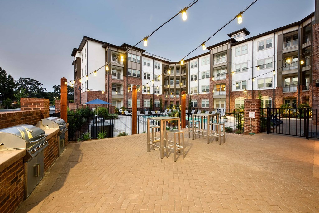 Gas grills at Tapestry Bocage Apartments in Baton Rouge, LA Outdoor Seating and grilling stations at Tapestry Bocage Apartments in Baton Rouge, LA