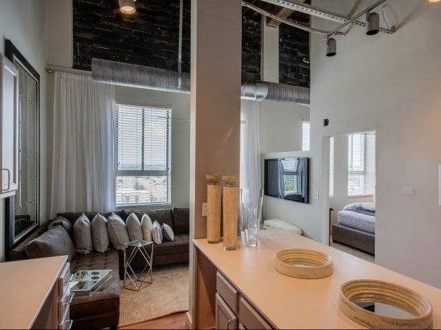 Kitchen Area With Living Room View at The Tower Apartments, Tuscaloosa