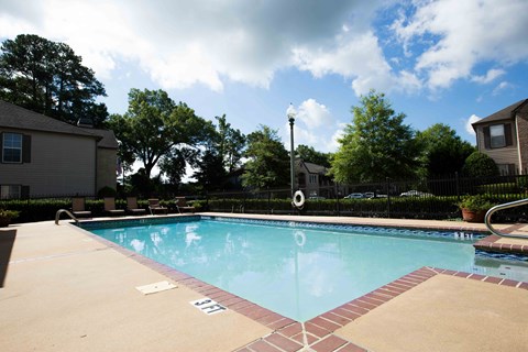 swimming pool and seating at Village at Caldwell Mill Apartments in Birmingham, Alabama