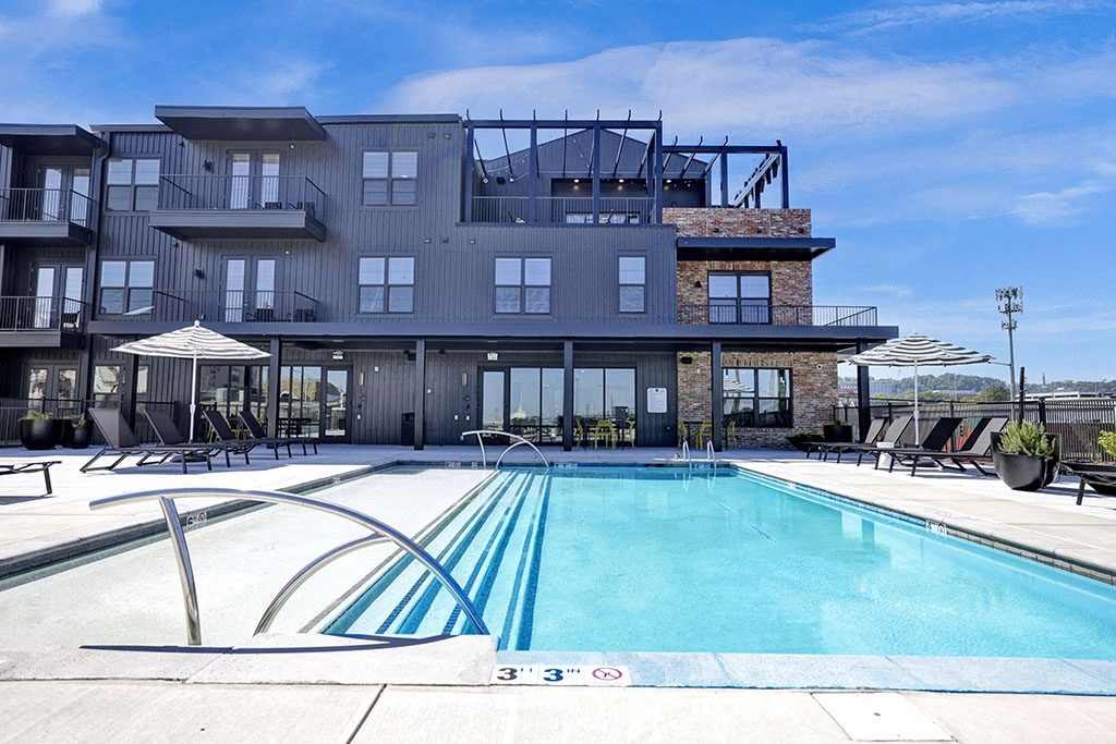 Resort-Style Rooftop Pool and Umbrellas at Artisan Flats Apartments in Birmingham, AL