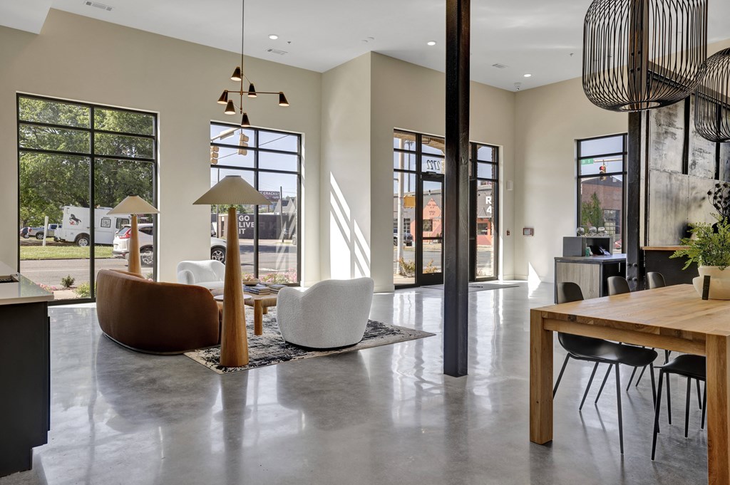 Lobby at Artisan Flats Apartments in Birmingham, ALrge windows and a table and chairs