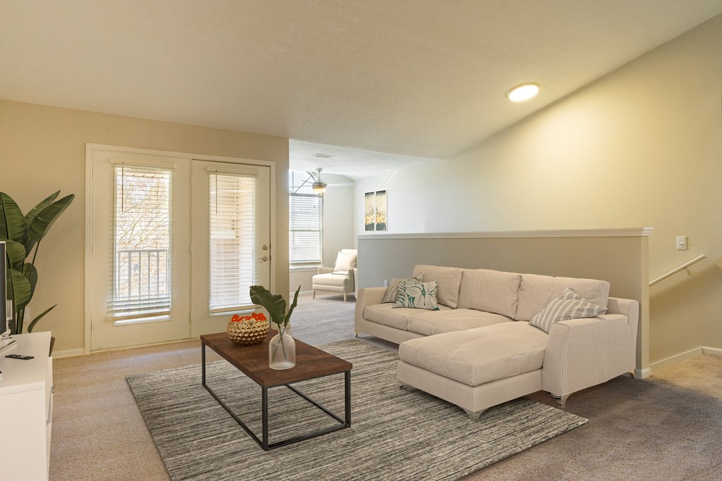a living room with a couch and a coffee table