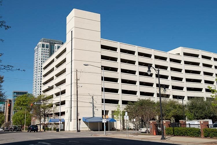 a large white building on the side of a street