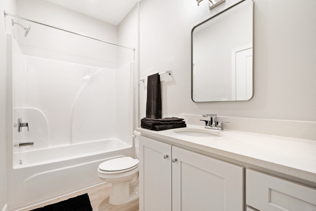 a bathroom with a sink toilet and a shower