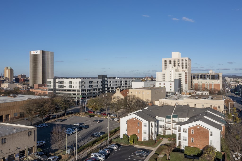 A cityscape with buildings and cars.