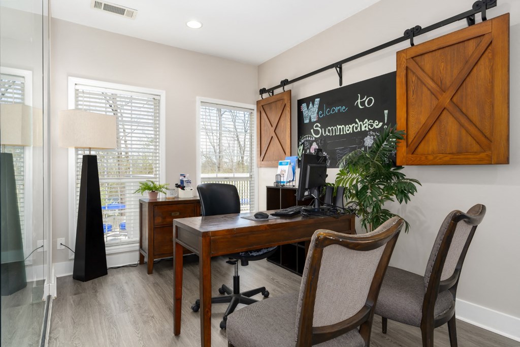 Leasing office desk, wood floors and seating in Summerchase at Riverchase in Hoover, Alabama