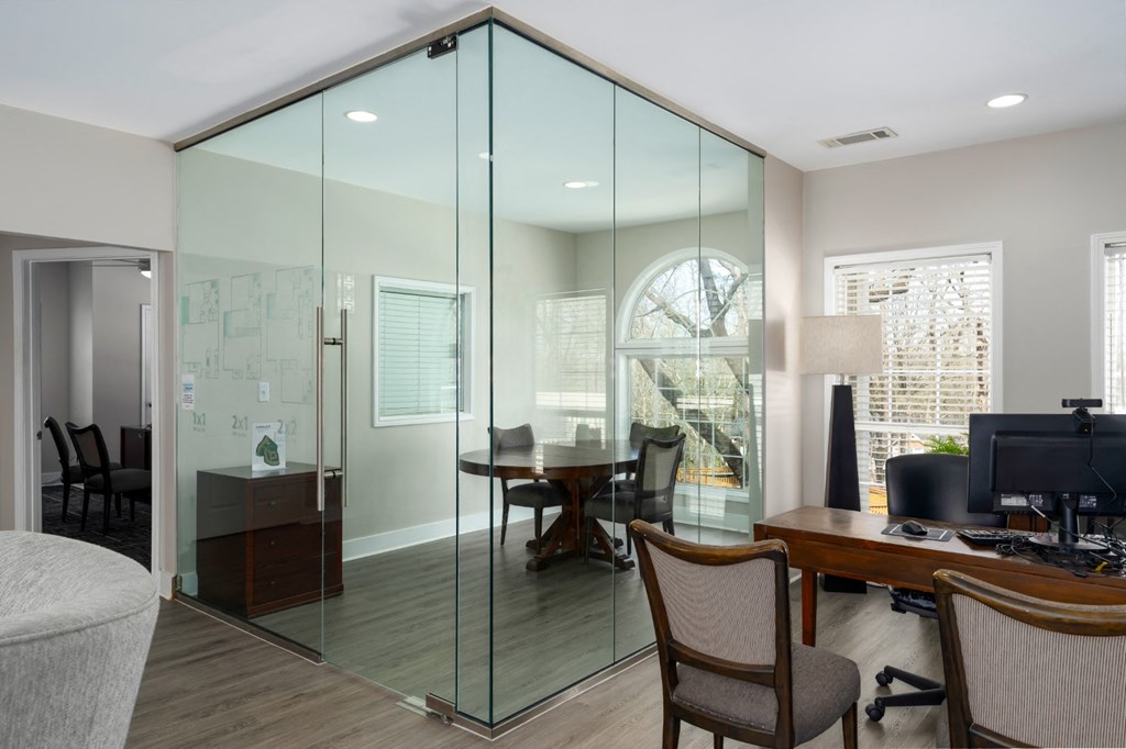 Leasing office with conference area, wood floors and seating in Summerchase at Riverchase in Hoover, Alabama